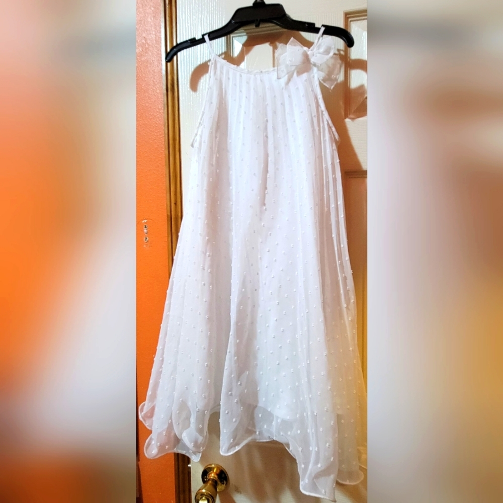 White girl's dress size L (10-12). You can dress up or dress down.